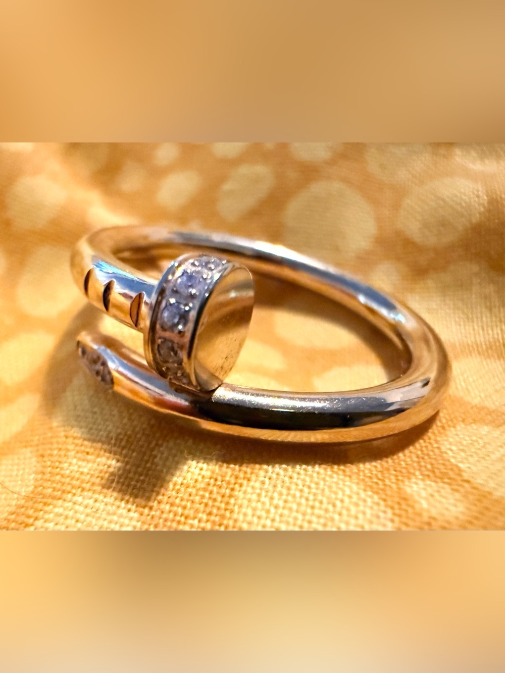Gold tone nail ring with tiny cubic zirconias